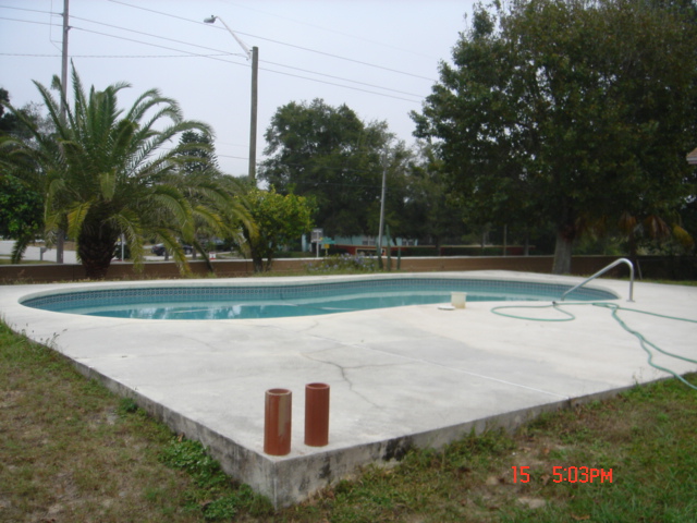 big pool deck cracks caused by Florida sinkhole