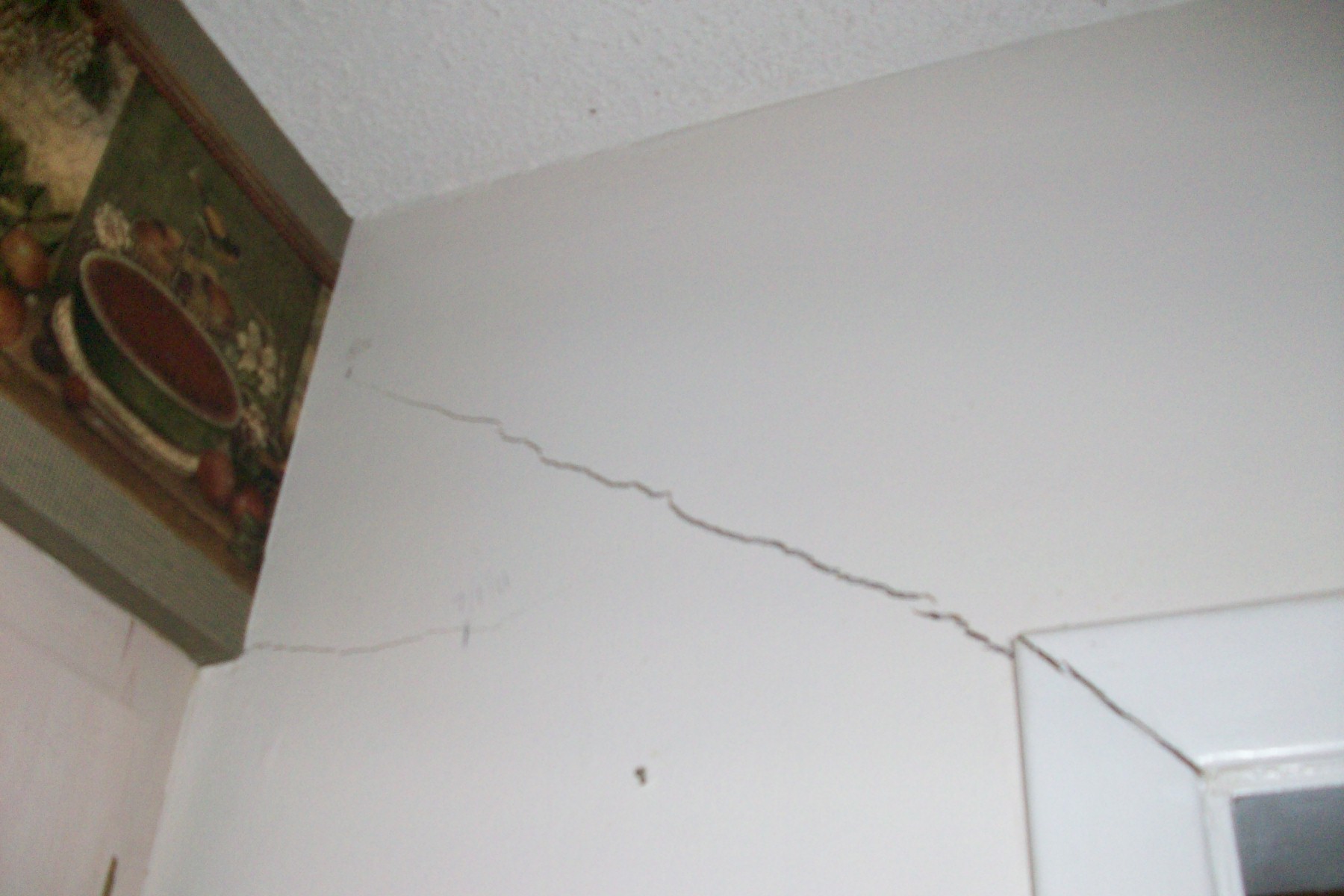 More cracks over the door. Florida sinkhole buyer.