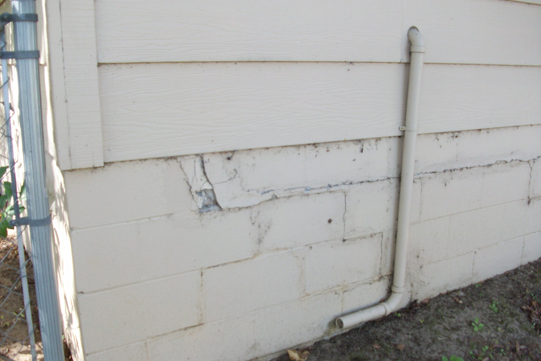 Stair step cracks in rear foundation Florida sinkhole home